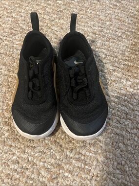 Nike Kids Black and White Athletic Slip-On Sneakers with Gold Swoosh